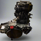 "High-performance dirt bike engine part finished with Cerakote, showcasing a sleek and durable coating for enhanced protection and aesthetics in motocross applications. The image highlights the engine's precision engineering and vibrant color, demonstrating its suitability for extreme conditions and competitive racing."